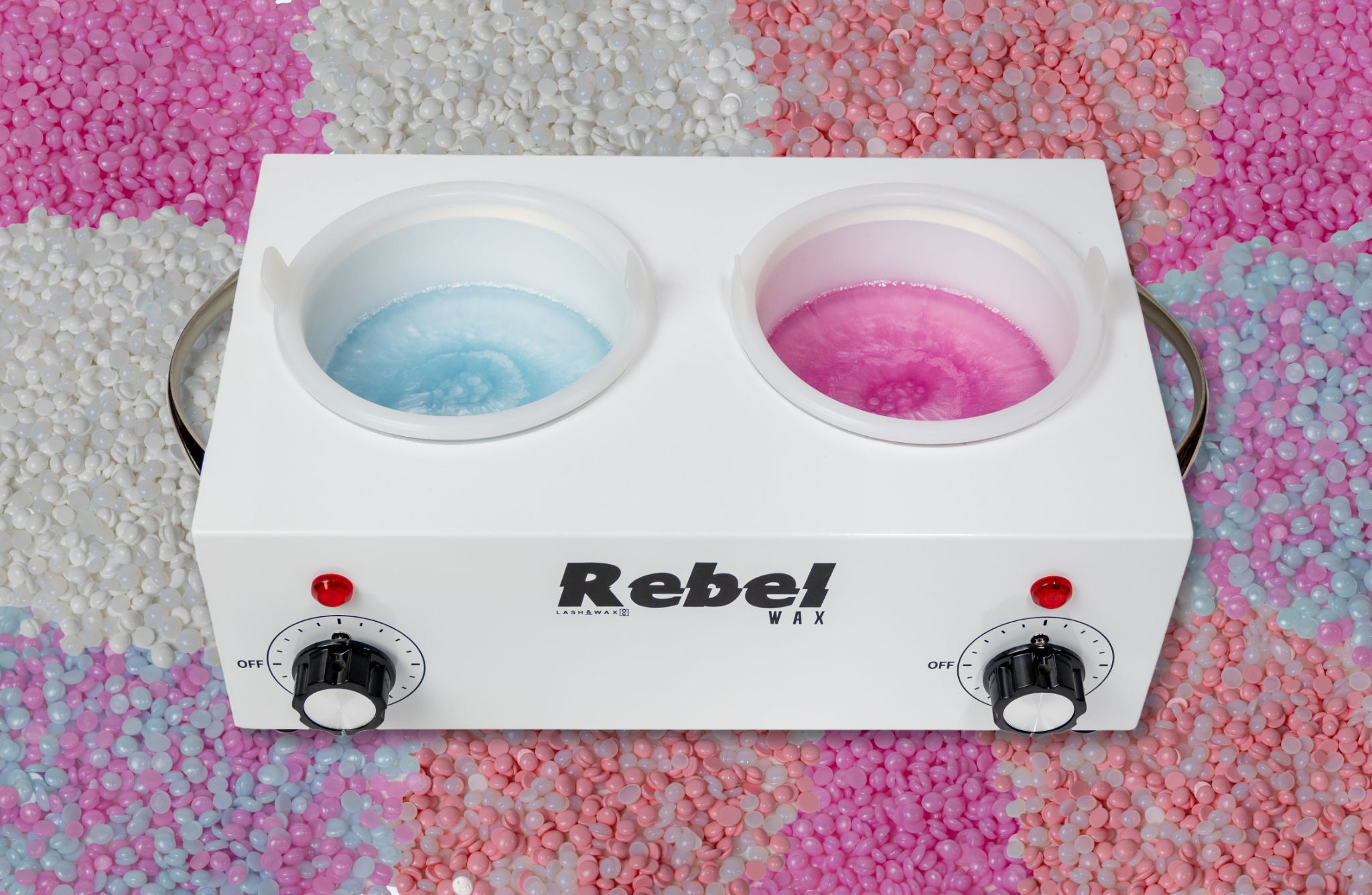 photo of a wax warmer pot for hair removal with light blue melted wax in one pot and melted hot pink colored wax in the other.